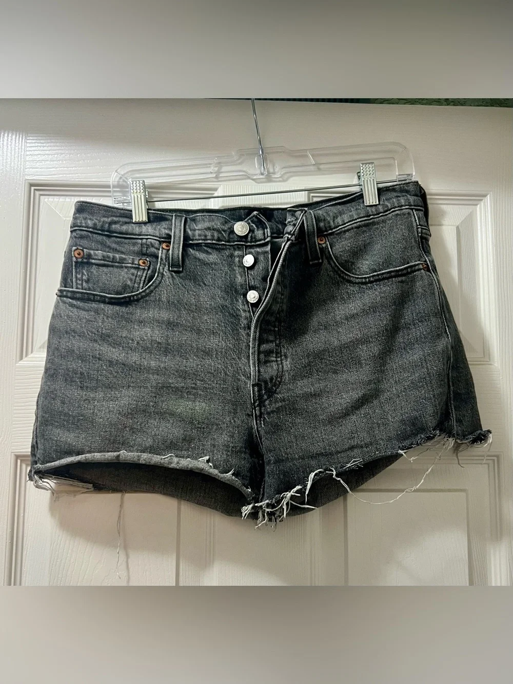 Levi’s Mid-Rise Black Denim Cutoff Shorts